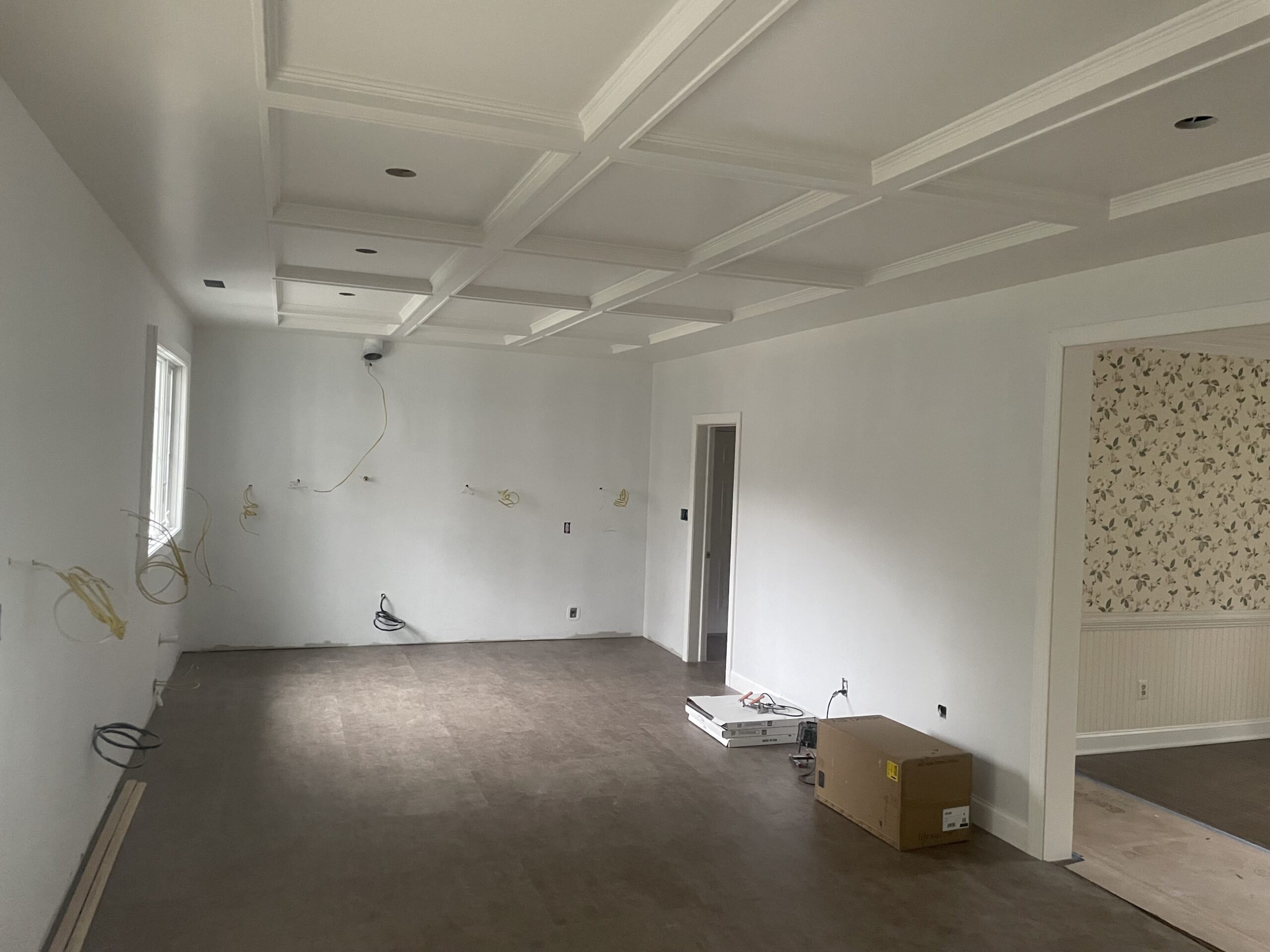 An empty room with a box on the floor